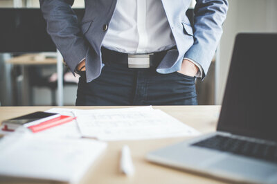 businessman-standing-in-his-office-picjumbo-com