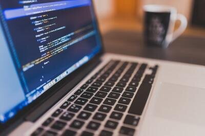 ERP vendor implementation services - laptop and code