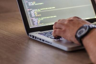 open source ERP - person coding